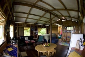 inside of the cabin- kitchen, bed and living space