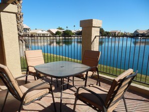 view of lake from enclosed patio