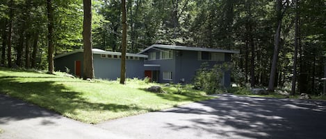 Set back from the quiet road, the house offers a peaceful retreat from the city.