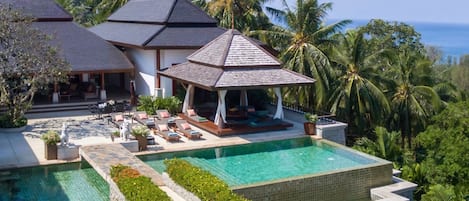 An aerial view showing part of  Villa Sanyanga, with Surin Beach just below