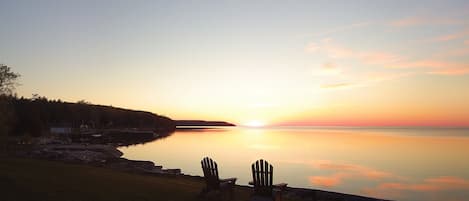 Nightly sunsets on the lake shore on the property:view to Door Bluff