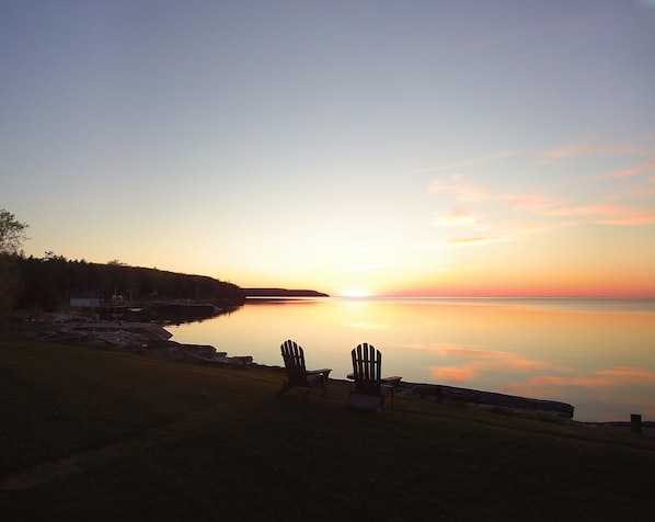 Nightly sunsets on the lake shore on the property:view to Door Bluff