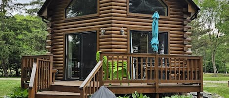 Back Deck with Bench seating and Table. 
Charcoal grill, bring charcoal 