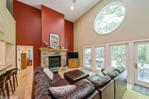 Great Room with Woodburning Fireplace/Hearth, 2.5 stories ceiling, skylight.