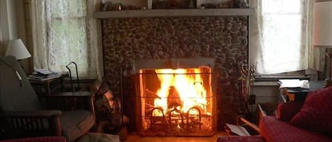 Living room and fireplace on a cool fall day.