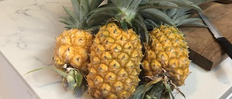 Pick up some fresh pineapple at the local farmers markets for your vacation
