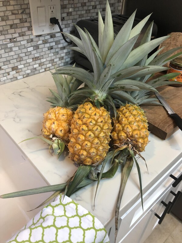 Pick up some fresh pineapple at the local farmers markets for your vacation