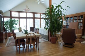 combined dining and ,giving area in large cathedral ceiling room with incredible