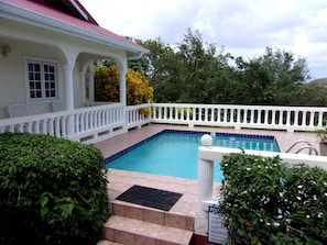Private pool surrounded by lush vegetation