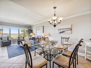 Dining Table with Seating for Six Offers Ocean Views at 1890 Beachside Tennis