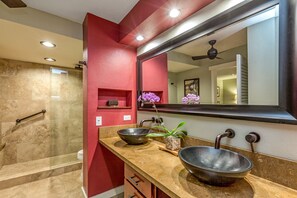 master bath with double sinks and walk in shower