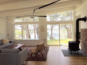 Breezy living room with sliders to the bay path...