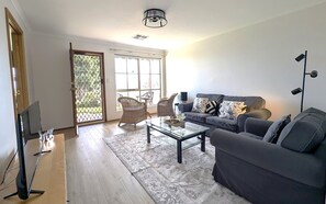 Separate Lounge area leading to front of home with seaviews