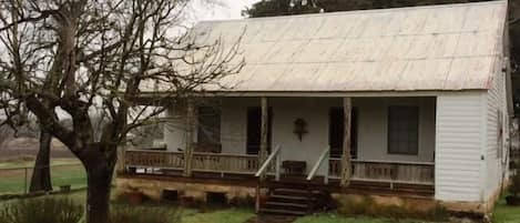 The outside of the farm house located on 70 acres!