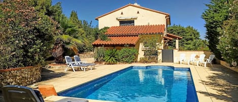 The view from the far end of the pool area, looking back towards the house
