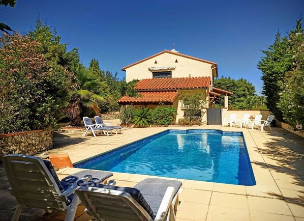 The view from the far end of the pool area, looking back towards the house
