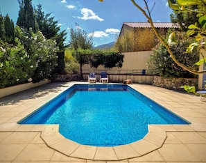 Photo from the terrace across the pool. Hills beyond