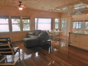 Living Area- Couch pulls out to a bed. Garage door separates kitchen and porch