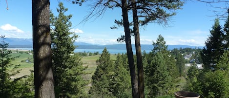 The view from the deck of Flathead Lake and the Mission and Swan Mountains. 