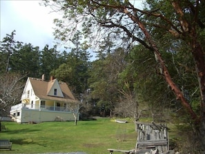 View of the house from the beach steps, hottub to the left