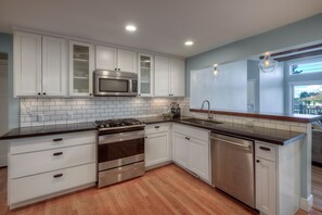 Renovated kitchen, quartz countertops. Open concept. Stainless steel appliances.