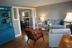 Living room and dining room. Dining area seats 5 at table + 2@quartz countertop.