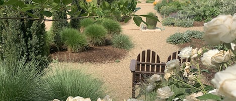 view of private guesthouse garden (guesthouse in background)