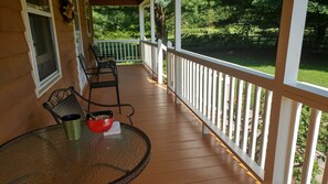 Covered front deck. Great for breakfast, listening to  birds and deer watching.