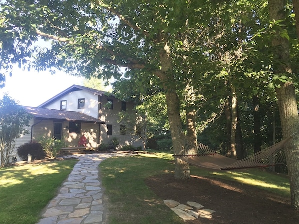 Flagstone walkway leading to the house. Don't miss the hammock on the way!