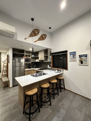 Fully-equipped kitchen with modern appliances and amenities