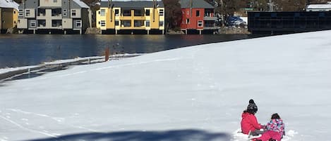 Our girls enjoying the snow on the resort grounds where our chalet is located.