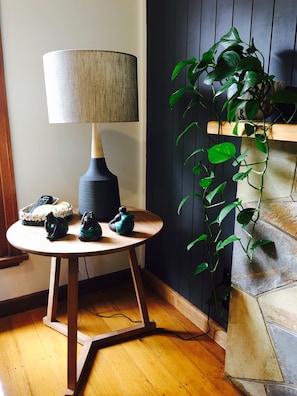 Light filled lounge room features scandi style home wares.