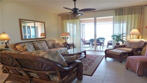 Living area with view of balcony beyond.