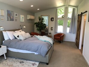 Primary bedroom #1 looking to the east.  Get up with the sunrise. queen bed