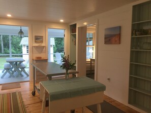 The reclaimed stainless island provides plenty of work space in the kitchen.