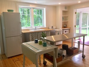 Cheery and light filled cottage kitchen with all the essentials.