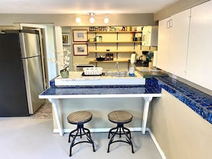 kitchen area with bar stools