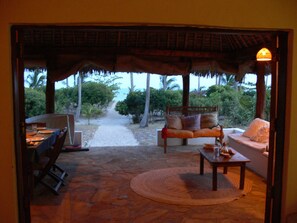 Beach Front terrace with dining and lounging area 