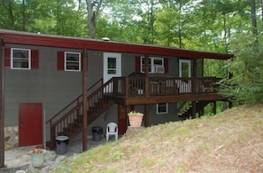 Relax on the open side porch or the front screened in porch