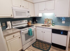 Beautifully updated kitchen countertops and backsplash