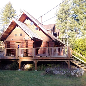 The Enchanted Woods Waterfront Log Cabin at Secret Cove