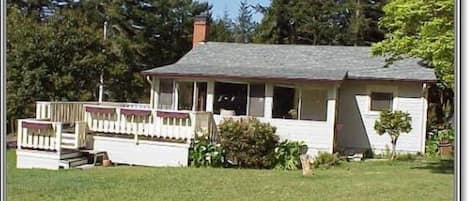 One of two homes on acre plus, surrounded by trees and meadow with lots of sun.