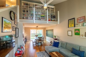 Open living room / dining room with lofted library.