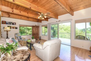 Rustic living room area with beautiful wood beam ceilings and leather furniture