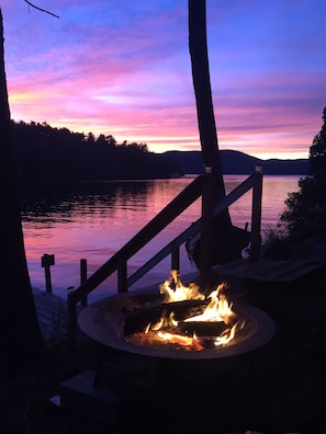 Sunset and the firepit just below the house on the water