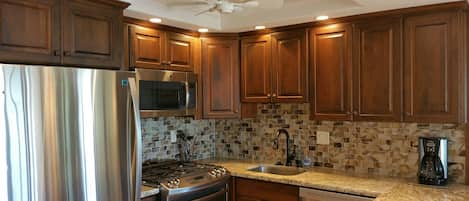 New Kitchen With Custom DeWills Cabinets and Stainless Steel Appliances