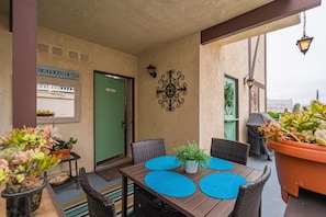 one of three private patios at front entrance