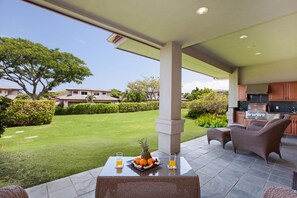 Relax and dine on the main lanai with the additional outdoor kitchen