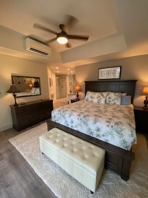 King sized primary bedroom with newly renovated bathroom.