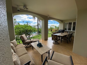 Relax on the wrap around lanai just steps from the pool!